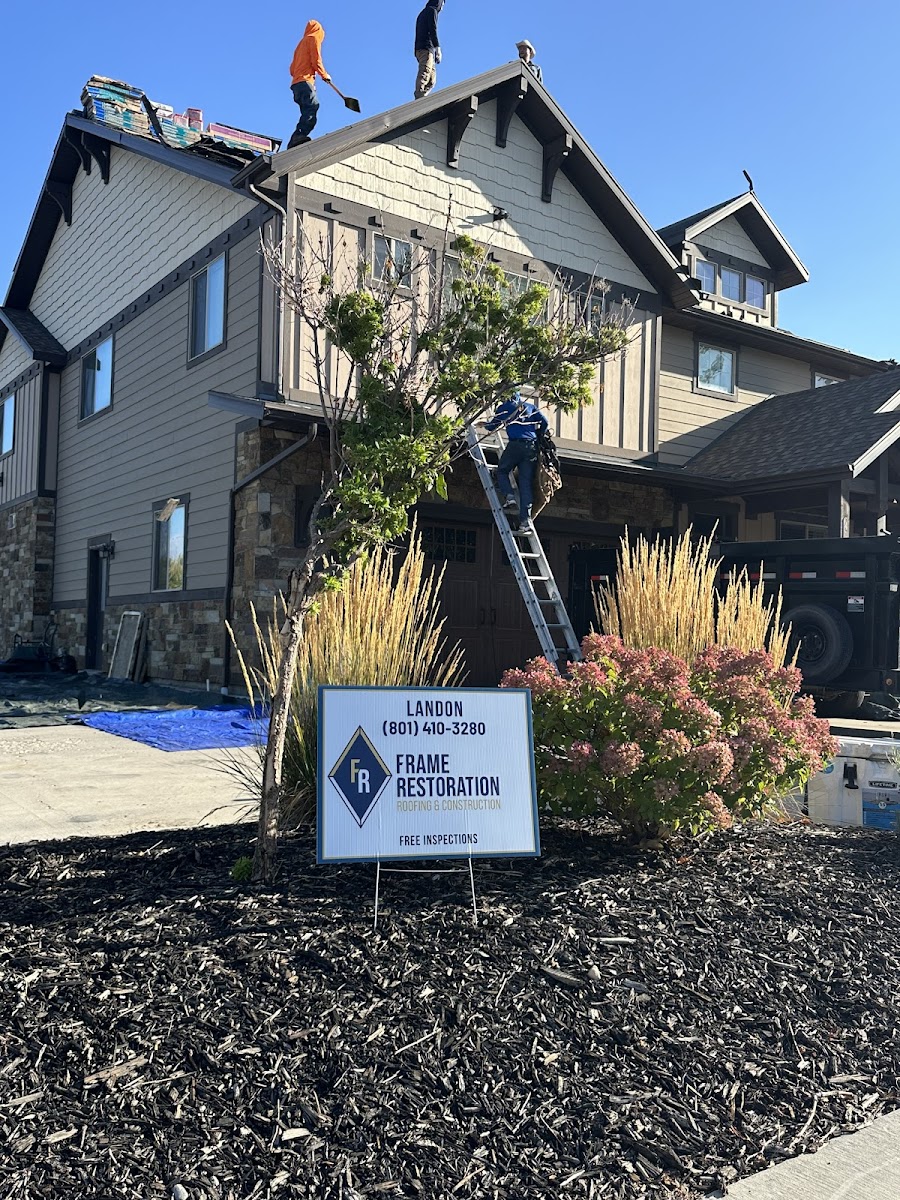Frame Restoration crew working on residential roof replacement in Utah
