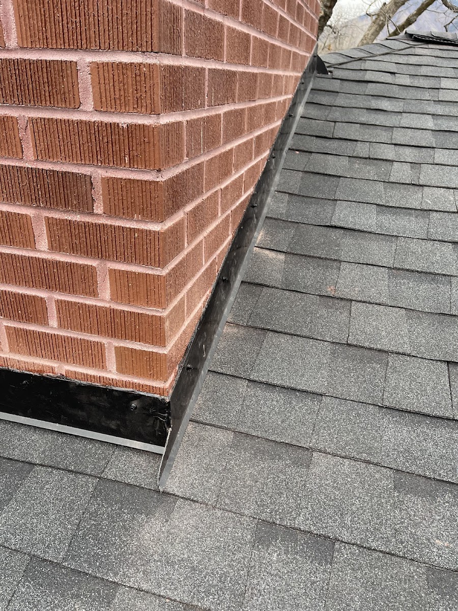 Close-up of chimney flashing repair on Utah residential roof