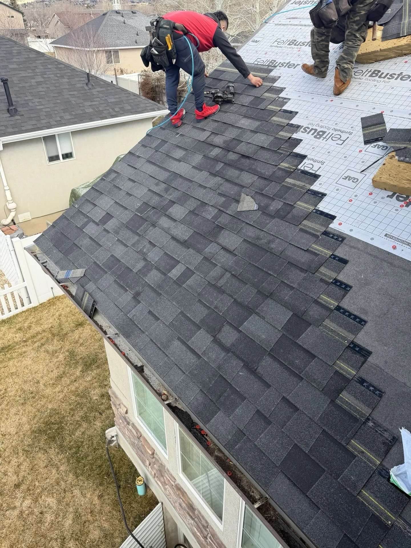 Frame Roofing crew installing new roof in Heber City, Utah