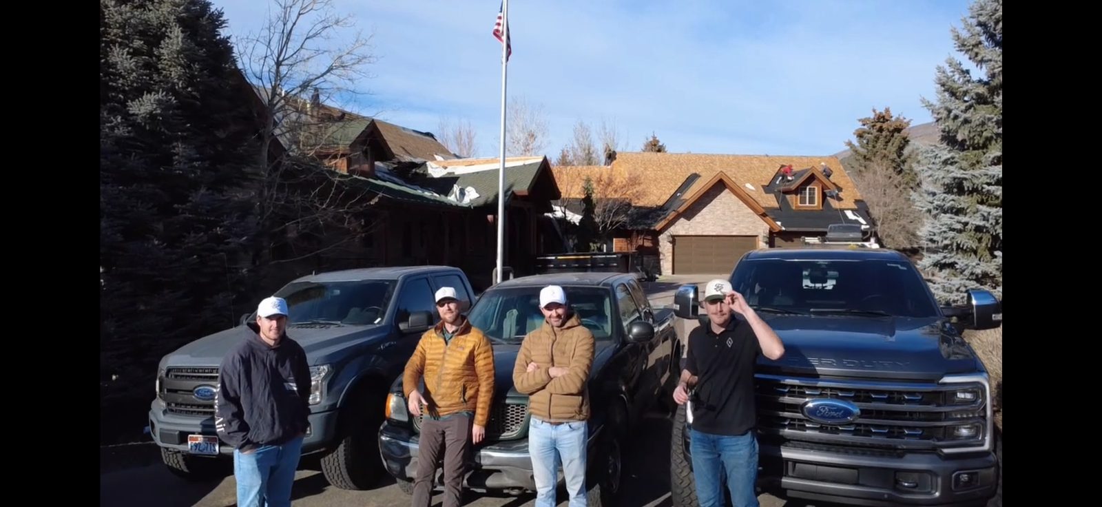 Crew members standing by Ford trucks at Heber Valley project