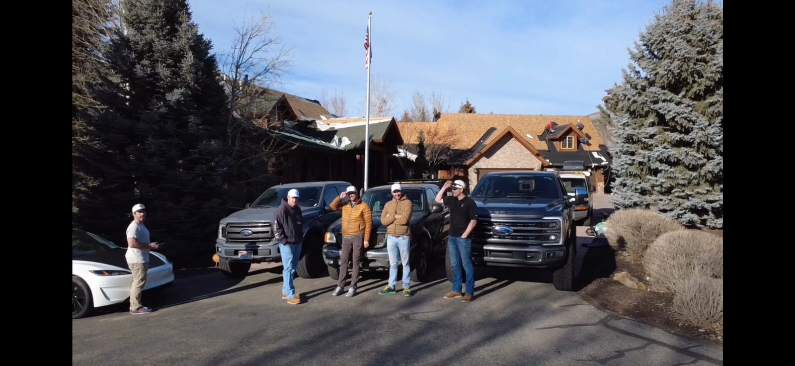 Full Frame Restoration crew with trucks at Heber Valley job site