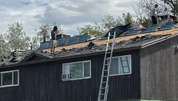 Commercial multifamily reroof in Millcreek Utah with crew on site