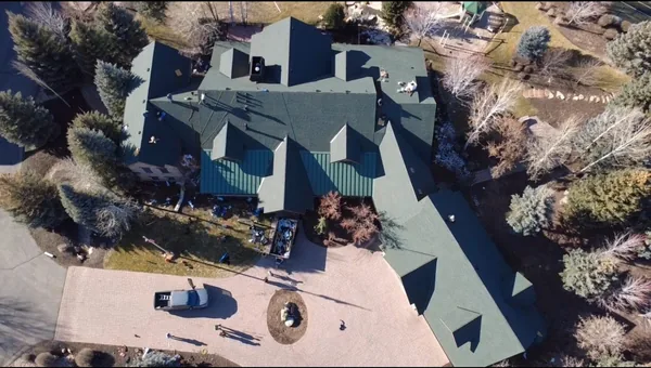 Completed roof with clean gutter lines and premium shingles