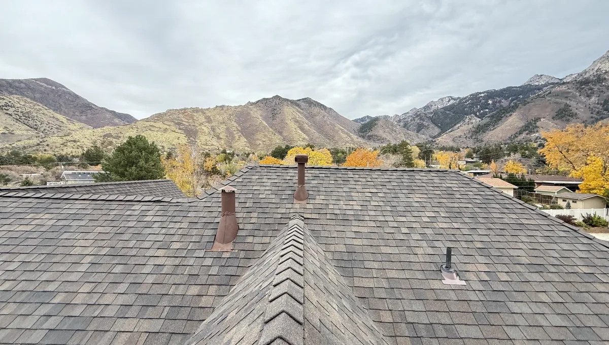 Completed residential reroof in Holladay Utah with Wasatch mountain backdrop