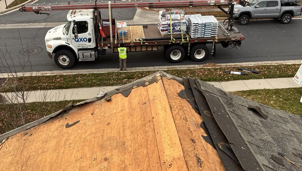 Storm damage roof tear-off in South Jordan Utah with material delivery in progress